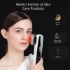 A woman using the KAKUSAN Skincare Device to enhance the effects of her skincare products, including facial masks, moisturizers, and serums.